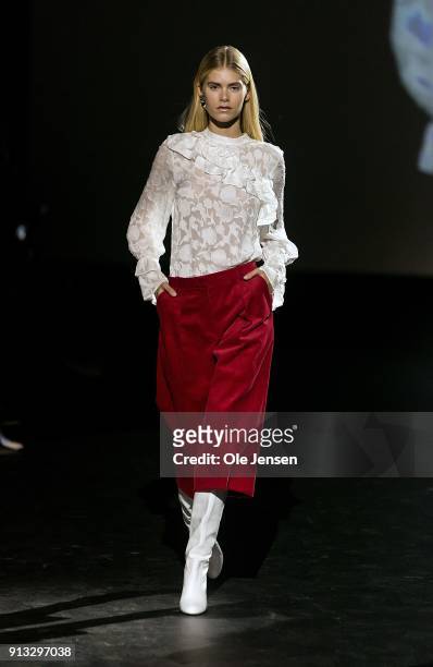Model walks the runway at the Baum und Pferdgarten show during the Copenhagen Fashion Week Autumn/Winter18 on February 1, 2018 in Copenhagen, Denmark.