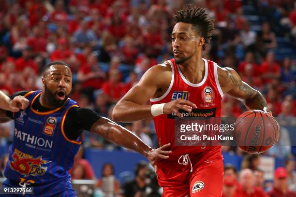 Jean-Pierre Tokoto of the Wildcats works to the basket against Shannon Shorter of the 36ers during the round 17 NBL match between the Perth Wildcats...