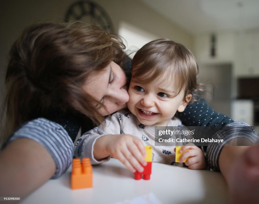 A mum and her 1 year old baby boy making a selfie