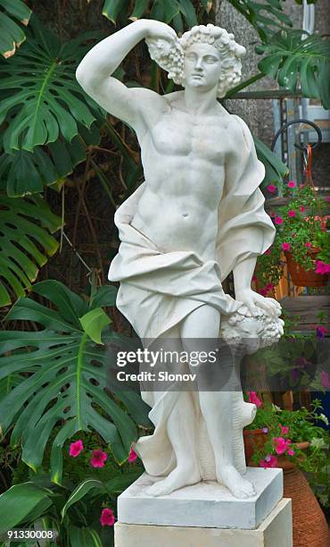 ancien statue in the garden - marble sculpture stock pictures, royalty-free photos & images