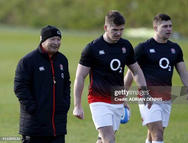 England's coach Eddie Jones, , England's centre Owen Farrell and England's Ben Youngs walk during a team training session at Pennyhill Park in...