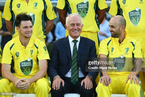 Peter Handscomb, Australian Prime Minister Malcom Turnbull and Nathan Lyon chat during a team photo before the One Day Tour Match between the Prime...
