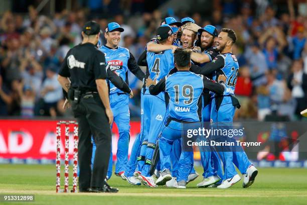 Adelaide Strikers players celebrate winning the Big Bash League match between the Adelaide Strikers and the Melbourne Renegades at Adelaide Oval on...