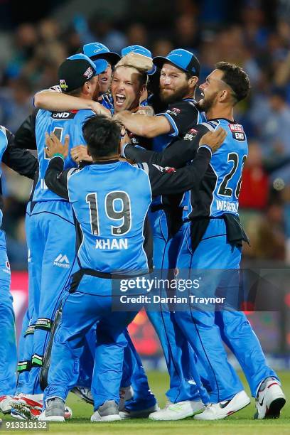 Adelaide Strikers players celebrate winning the Big Bash League match between the Adelaide Strikers and the Melbourne Renegades at Adelaide Oval on...