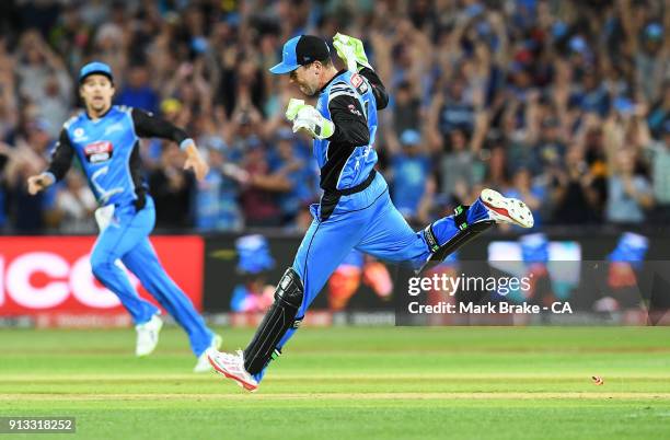 Harry Nielsen of the Adelaide Strikers takes the bails off after the last ball to win the game during the Big Bash League match between the Adelaide...