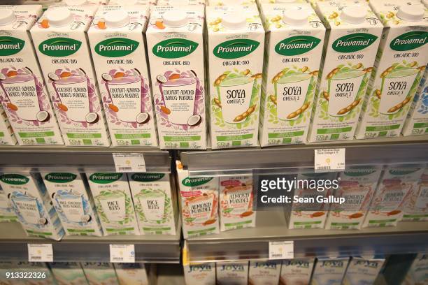 Carstons of soy, almond and rice milk stand on display at a Veganz vegan grocery store on February 2, 2018 in Berlin, Germany. Veganz has three...