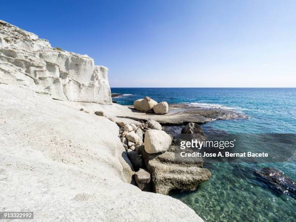 rocky coast of the cabo de gata with formations of volcanic rock of white color. cabo de gata - nijar natural park, cala del plomo, biosphere reserve, almeria,  andalusia, spain - biosphere planet earth stock pictures, royalty-free photos & images