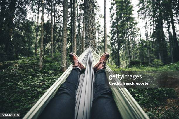 man resting on the hammock - hammock camping stock pictures, royalty-free photos & images