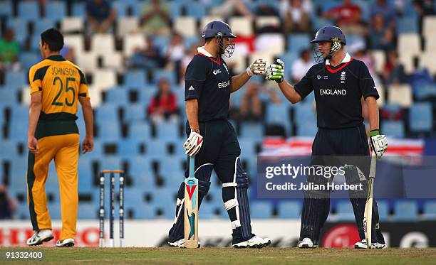 Tim Bresnan and Luke Wright of England touch gloves during The 1st ICC Champions Trophy Semi Final between England and Auustralia at Supersport Park...