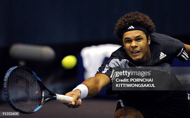 Jo-Wilfried Tsonga of France returns to Macro Chiudinelli of Switzerland during their quarter-final round of ATP Thailand Open tennis tournament...