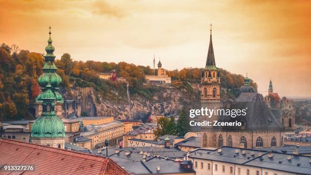 aerial view from the roof of hohensalzburg fortress during sunrise and sunset in the city of salzburg, austria - giardini di mirabell foto e immagini stock