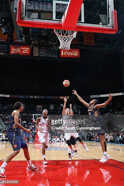 Shalee Lehning of the Atlanta Dream puts up a shot against Sandrine Gruda of the Connecticut Sun during the WNBA game on September 11, 2009 at...