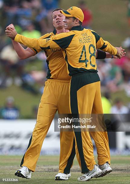 Peter Siddle of Australia celebrates the wicket of Luke Wright of England with team mate Michael Hussey during the ICC Champions Trophy 1st Semi...