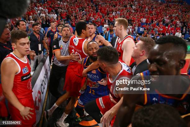 Players from both sides become involved in a melee during the round 17 NBL match between the Perth Wildcats and the Adelaide 36ers at Perth Arena on...