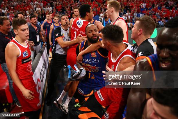 Players from both sides become involved in a melee during the round 17 NBL match between the Perth Wildcats and the Adelaide 36ers at Perth Arena on...