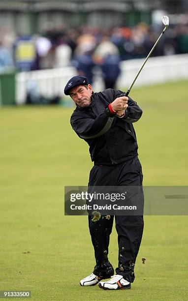 Pop star Huey Lewis plays his second shot to the first green during the second round of The Alfred Dunhill Links Championship at The Old Course on...