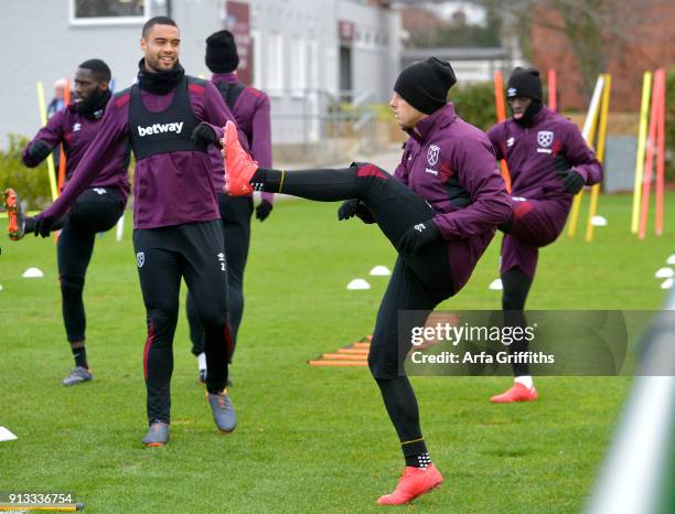 Winston Reid and Javier Chicharito Hernandez of West Ham United during training at Rush Green on February 2, 2018 in Romford, England.