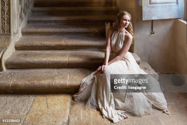 pretty woman in a castle - princess stock pictures, royalty-free photos & images