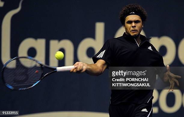 Jo-Wilfried Tsonga of France returns to Macro Chiudinelli of Switzerland during their quarter-final round of ATP Thailand Open tennis tournament...