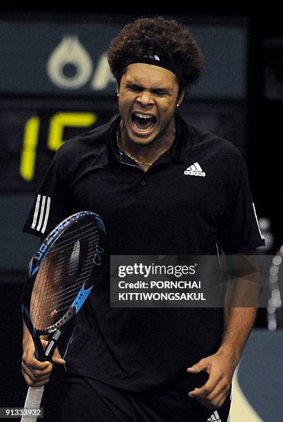 Jo-Wilfried Tsonga of France reacts to Macro Chiudinelli of Switzerland during their quarter-final round of ATP Thailand Open tennis tournament match...