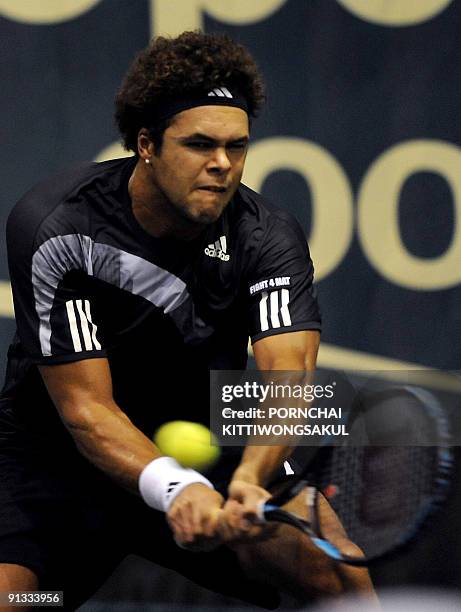 Jo-Wilfried Tsonga of France returns to Macro Chiudinelli of Switzerland during their quarter-final round of ATP Thailand Open tennis tournament...