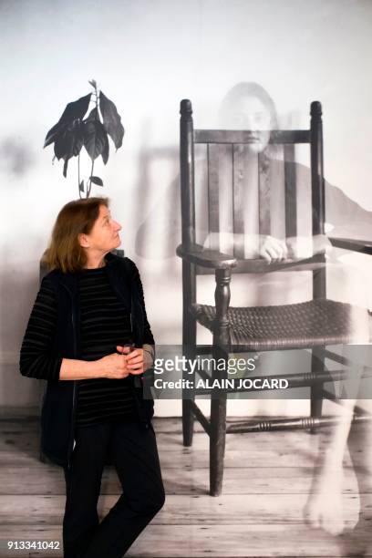 Photographer Susan Meiselas poses in front one of her pictures during the preparation of her exhibition at the Jeu de Paume museum on February 2 in...