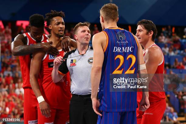 Referee Damian Lyons separates Jean-Pierre Tokoto of the Wildcats and Anthony Drmic of the 36ers during the round 17 NBL match between the Perth...