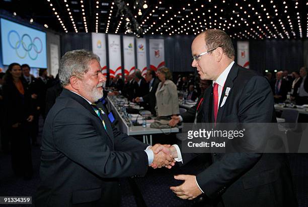 Brazil's President Luiz Inacio Lula da Silva greets Prince Albert of Monaco as he meets IOC members after the Rio de Janeiro 2016 bid presentation...