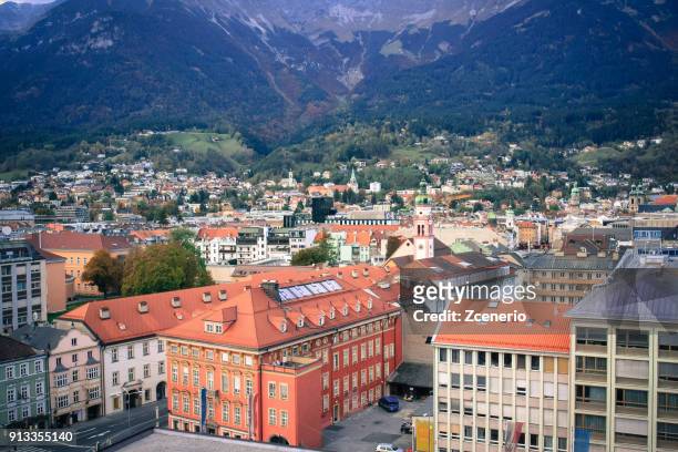 aerial view from the roof of hotel in the city of innsbruck, austria during autumn - giardini di mirabell foto e immagini stock