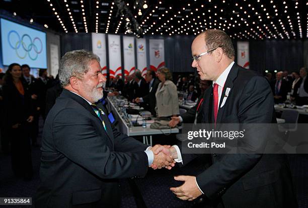 Brazil's President Luiz Inacio Lula da Silva greets Prince Albert of Monaco as he meets IOC members after the Rio de Janeiro 2016 bid presentation...