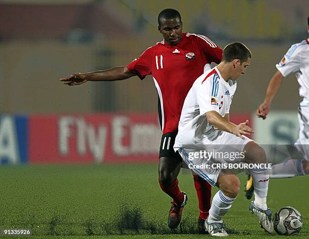 Paraguay�s defense Francisco Silva and Trinidad�s midfielder Khaleem Hyland fight for the ball during the second half of the game played between...