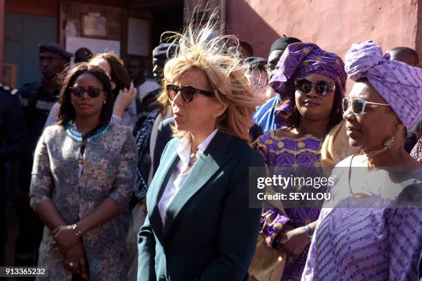 Wife of French President Brigitte Macron stands next to Annie Jouga deputy mayor of the island of Goree, once a west African slaving post, on...