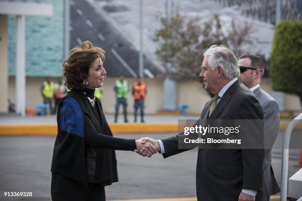 Roberta Jacobson, U.S. Ambassador to Mexico, shakes hands with Rex Tillerson, U.S. Secretary of State, right, at Benito Juarez International Airport...