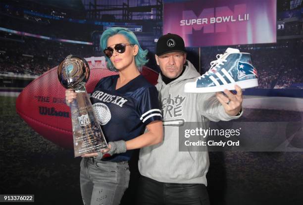 Jenny McCarthy and Donnie Wahlberg visit the SiriusXM at Super Bowl LII Radio Row at the Mall of America on February 2, 2018 in Bloomington,...