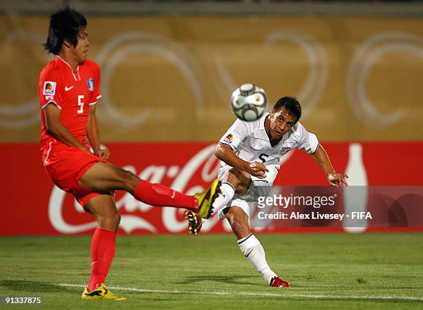 Danny Cruz of USA shoots past Kim Young Gwon of Korea Republic during the FIFA U20 World Cup Group C match between Korea Republic and USA at the...