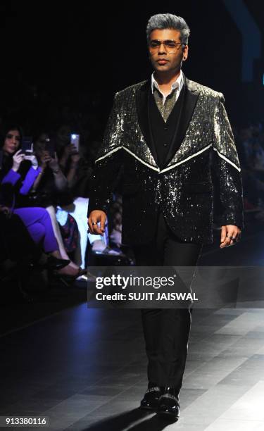 Indian Bollywood film director Karan Johar showcases a creation by designer Falguni Shane Peacock at the Lakmé Fashion Week Summer Resort 2018 in...