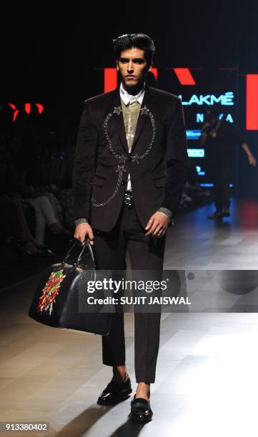 An Indian model showcases creations by designer Falguni Shane Peacock at the Lakmé Fashion Week Summer Resort 2018 in Mumbai on February 2, 2018. /...