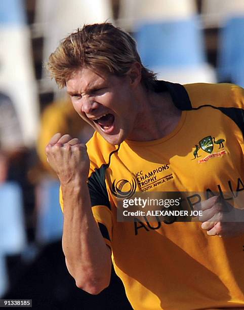 Australian bowler Shane Watson celebrates the dissmisal of England's cricketer Eoin Morgan for 9 runs during The ICC Champions Trophy 1st semi final...