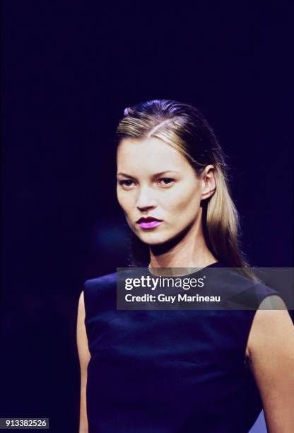 Model Kate Moss walks Prada's Spring 1998 RTW Milan Runway collection.