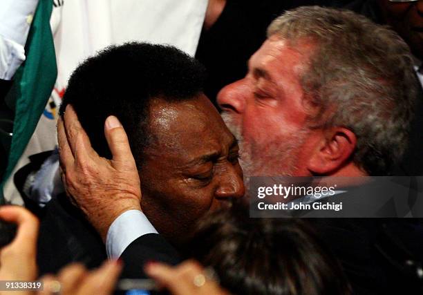 Brazilian football legend Pele is hugged by Brazilian President Luiz Inacio Lula da Silva after Rio De Janeiro won the vote to host the 2016 Olympic...