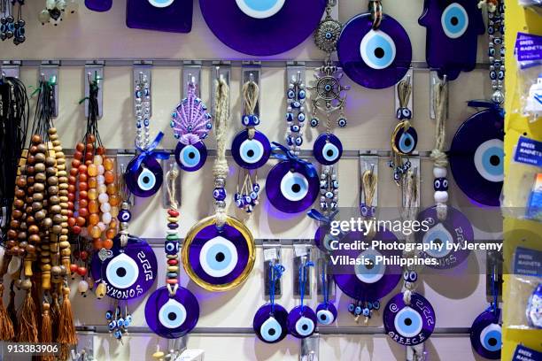 greek evil eye and worry beads, mykonos, greece - greek worry beads stock pictures, royalty-free photos & images