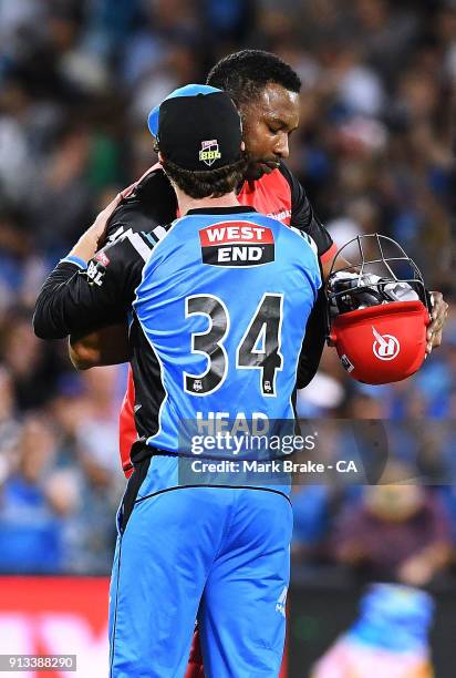 Travis Head of the Adelaide Strikers consols Kieron Pollard of the Melbourne Renegades after the Big Bash League match between the Adelaide Strikers...