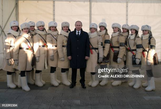 President Vladimir Putin poses with participants of celebrations to mark the Battle of Stalingrad during his visit to the "Russia is my history"...