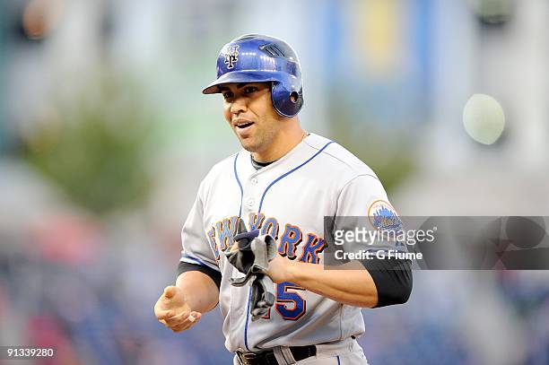 Carlos Beltran of the New York Mets stands on first base after a hit against the Washington Nationals at Nationals Park on September 30, 2009 in...
