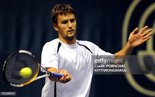 Macro Chiudinelli of Swiss returns to Jo-Wilfried Tsonga of France during their quarter-final round of ATP Thailand Open tennis tournament match in...