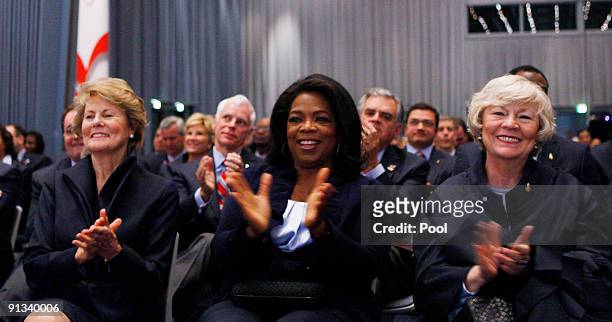 Television talk show host Oprah Winfrey, center, sits with other members of the U.S. Delegation as U.S. President Barack Obama finishes his...