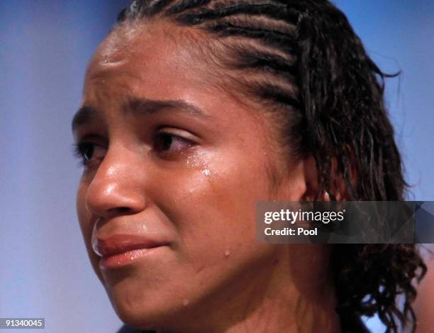 Brazilian Track and Field Olympian Barbara Leoncio, cries as she accompanies Brazil's President Luiz Inacio Lula da Silva, during the Rio de Janeiro...