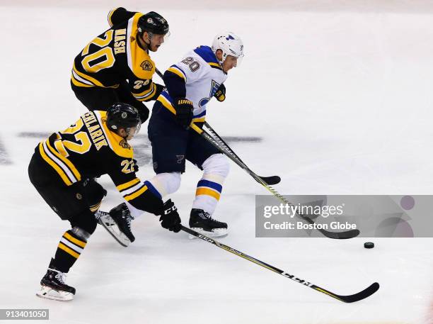 Boston Bruins' Peter Cehlarik, bottom, and Riley Nash defend against St. Louis Blues' Alexander Steen during the second period. The Boston Bruins...