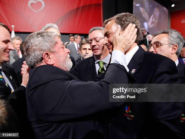 Brazil's President Luiz Inacio Lula da Silva, left, embraces Spain's Prime Minister Jose Luis Rodriguez Zapatero after it was announced that Rio de...