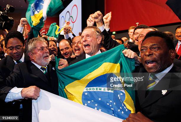 Brazil's President Luiz Inacio Lula da Silva, left, Rio 2016 bid President Carlos Arthur Nuzman, center, and Brazilian soccer great Pele, right,...